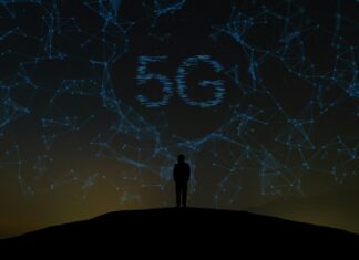 How Does 5G Technology Enhance Mobile Broadband Performance? 5G rendered Image outdoors with silhouette of person