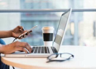 What Are the Key Advantages of VoIP for Businesses? Working laptop and mobile
