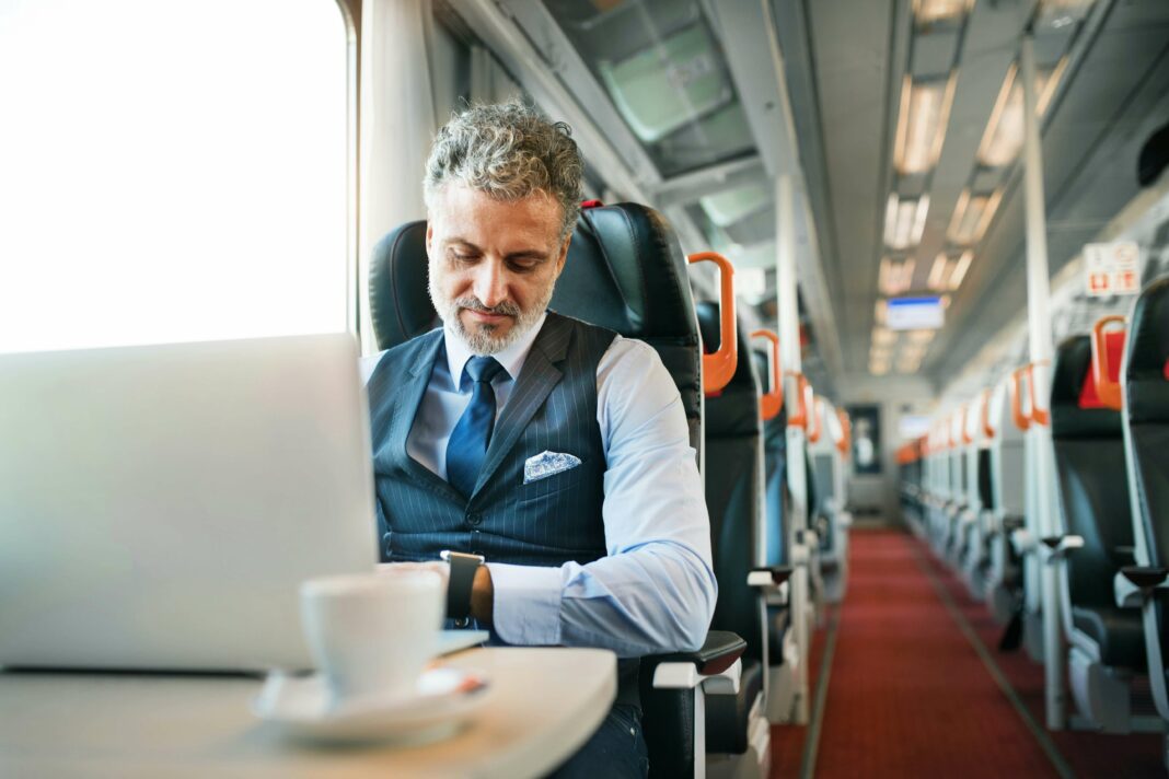How Does VoIP Impact Telecommuting Trends Man working on train