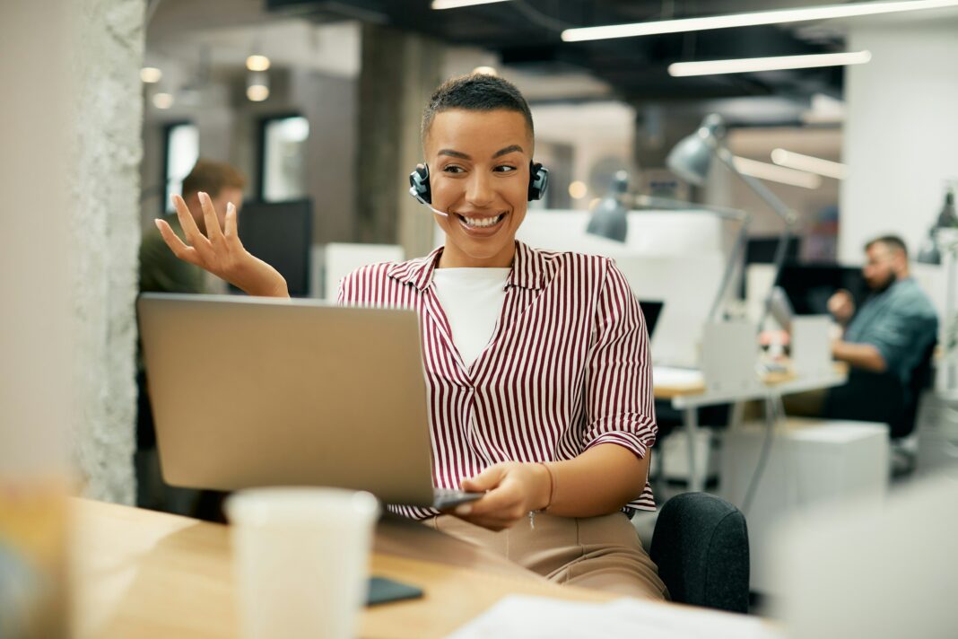 What To Consider When Choosing a VoIP Provider Woman working on phone call headset