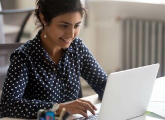 How Does Broadband Internet Support Cloud Computing? Business Owner Using Laptop