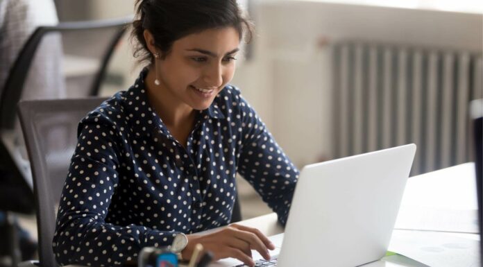 How Does Broadband Internet Support Cloud Computing? Business Owner Using Laptop