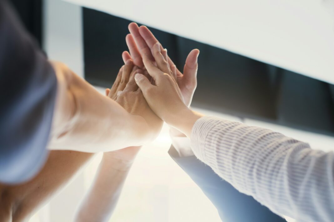 All hands in for teamwork
