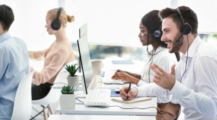 What Are the Key Differences Between VoIP and PBX Systems? Employees Using VoIP Systems