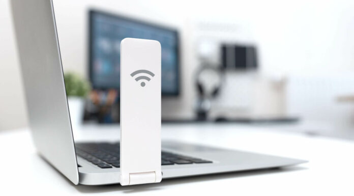 How Does Broadband Usage Vary Across Different Demographics? WiFi Dongle On Laptop