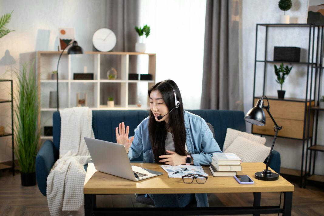 Young woman working from home digital communication