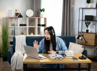 How Does VoIP Support Unified Communications? Young woman working from home digital communication