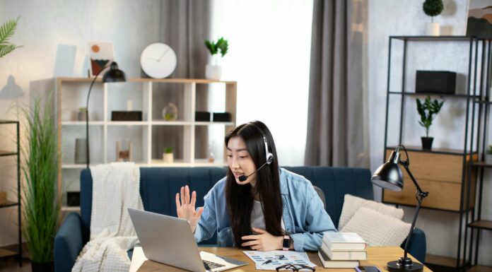 How Does VoIP Support Unified Communications? Young woman working from home digital communication