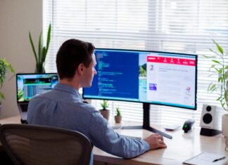 Can Mobile Broadband Support Remote Work and Telecommuting? A man sitting in his home office doing work ons his computer.