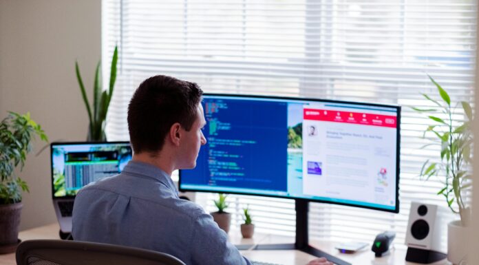Can Mobile Broadband Support Remote Work and Telecommuting? A man sitting in his home office doing work ons his computer.
