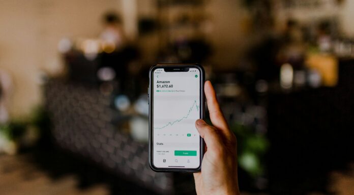 Can VoIP Systems Support Secure Financial Transactions? Unrecognisable person making a financial transaction on their phone