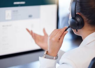 Is VoIP Scalable For Growing Businesses? Employee Using VoIP System