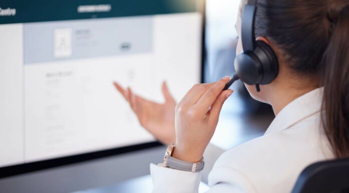 Is VoIP Scalable For Growing Businesses? Employee Using VoIP System