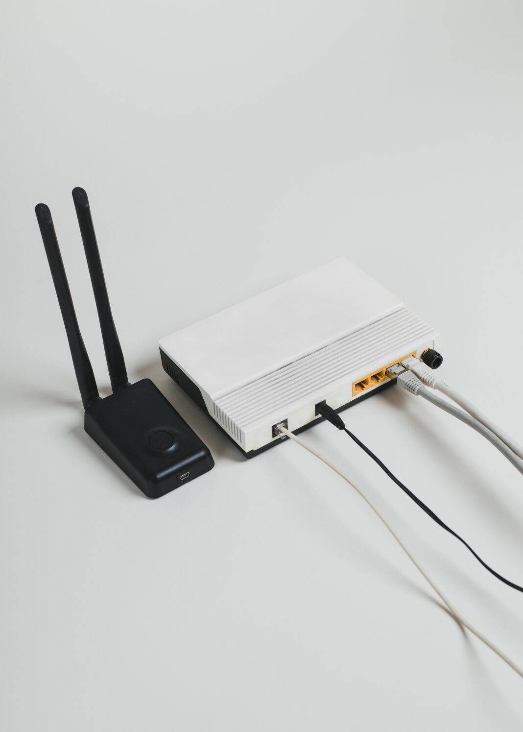 Photo of a white internet hub with a black modem