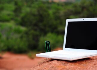 Can VoIP Systems Provide Reliable Communication In Remote Or Off-Grid Locations? Laptop In Remote Area