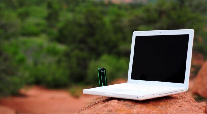 Can VoIP Systems Provide Reliable Communication In Remote Or Off-Grid Locations? Laptop In Remote Area