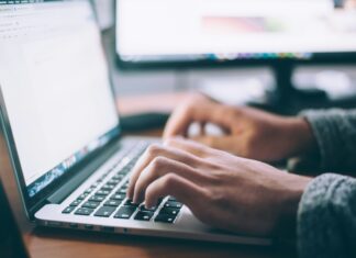 Does Mobile Broadband Enhance Productivity in the Workplace? Man typing on his laptop