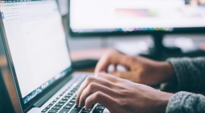 Does Mobile Broadband Enhance Productivity in the Workplace? Man typing on his laptop