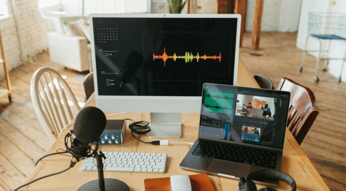 How Does Broadband Shape Digital Media Consumption Habits? Photo of a screen, microphone, and laptop busy recording video and audio