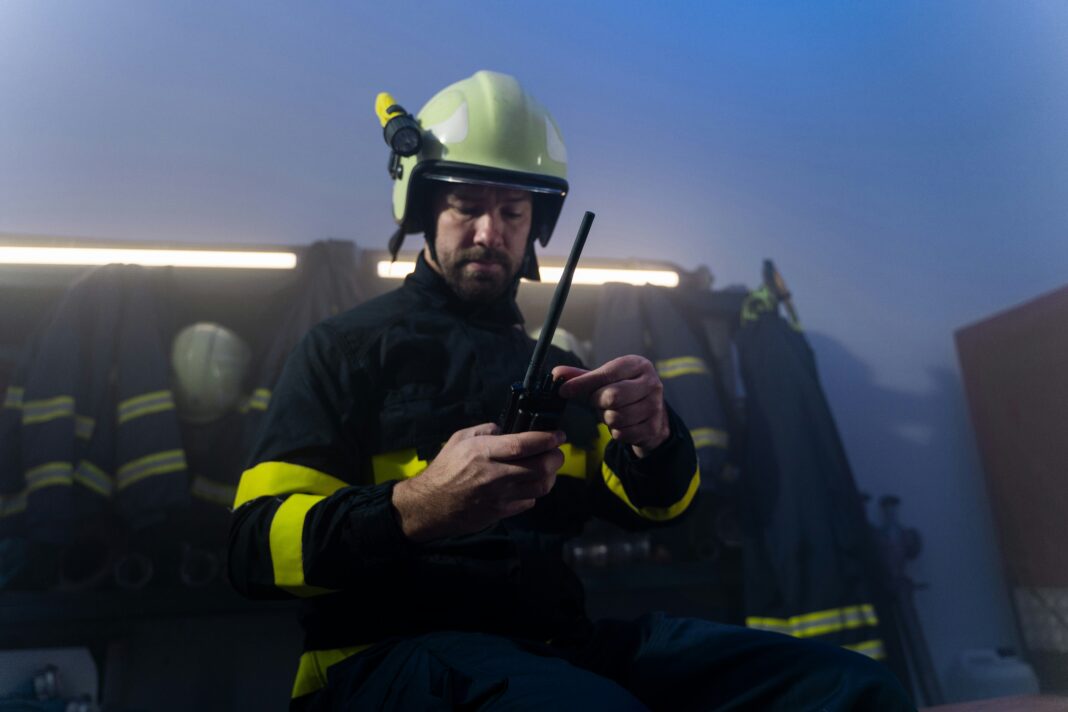 A firefighter responding to and emergency in full gear