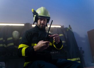 How Does Connectivity Enable Rapid Response in Emergency Situations? A firefighter responding to and emergency in full gear