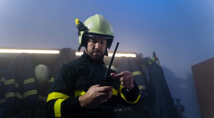 How Does Connectivity Enable Rapid Response in Emergency Situations? A firefighter responding to and emergency in full gear