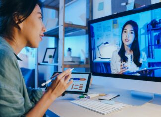 Top 10 Best Business VoIP Providers Two women talking to each other via video call