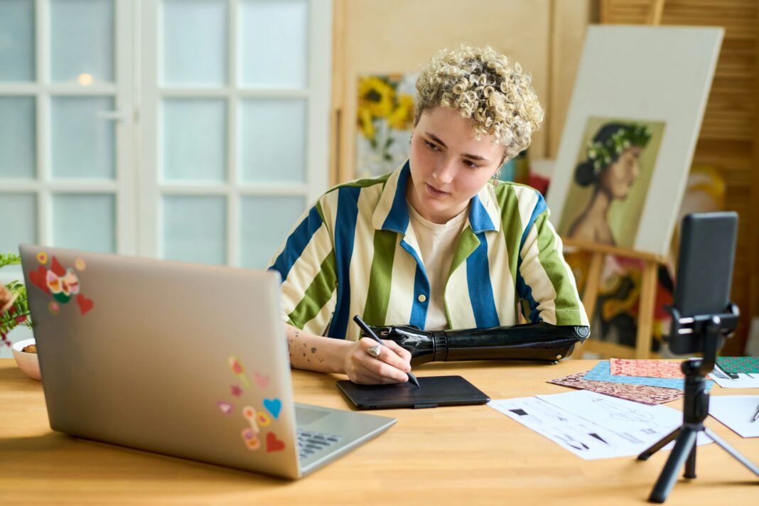 Boy sitting at his desk doing school work online