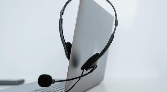 bOnline Recognised At 2024 Engage Awards Headset On Laptop