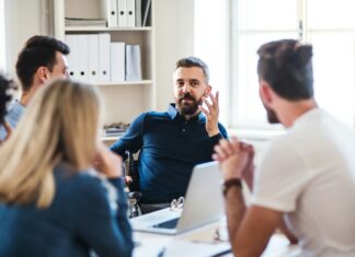 Tips To Secure Your Business Broadband A group of people sitting in an office talking