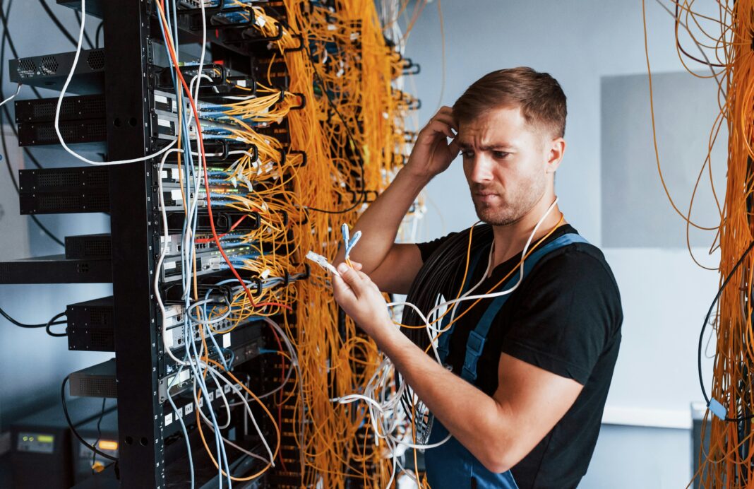 What Are the Maintenance Requirements for VoIP Systems? A man standing at