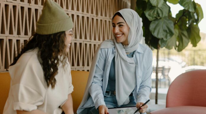 What Is Connectivity and Why Does It Matter? Two women sitting on a couch in an office with a tablet