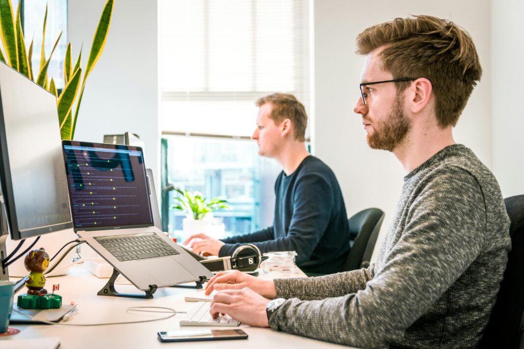 two-men-working-on-their-laptops