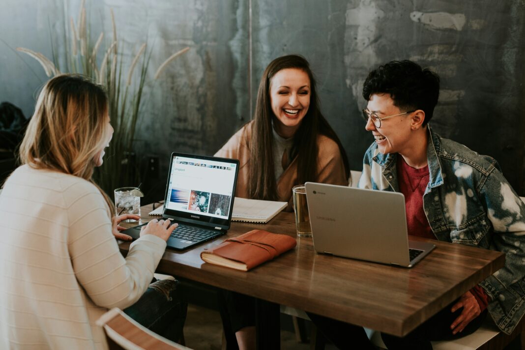 three-people-working-at-a-desk