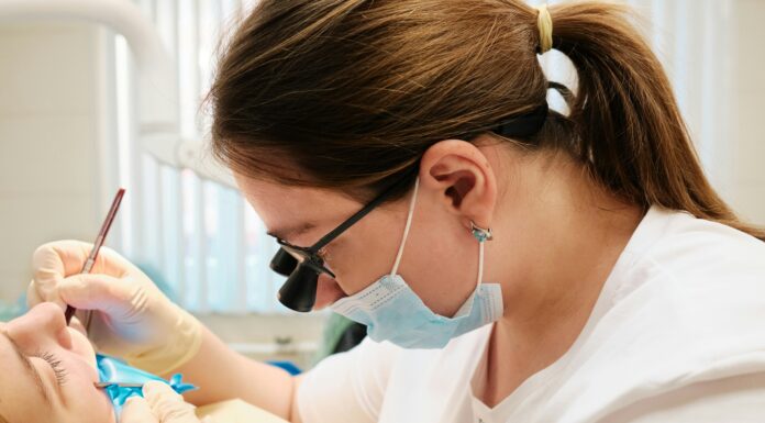 The Benefits of VoIP for UK Dental Clinics dentist-working-on-a-patient