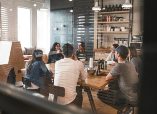 Tips for Choosing the Right VoIP Provider for Your UK Office people-sitting-around-a-table-in-an-office
