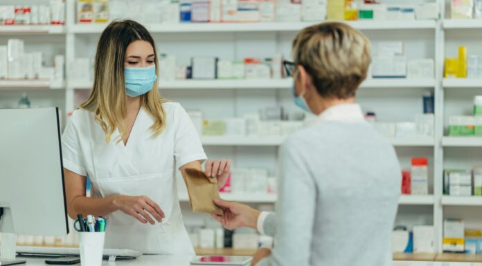 Why UK Pharmacies Are Switching to VoIP pharmacist-hading-medication-to-a-customer