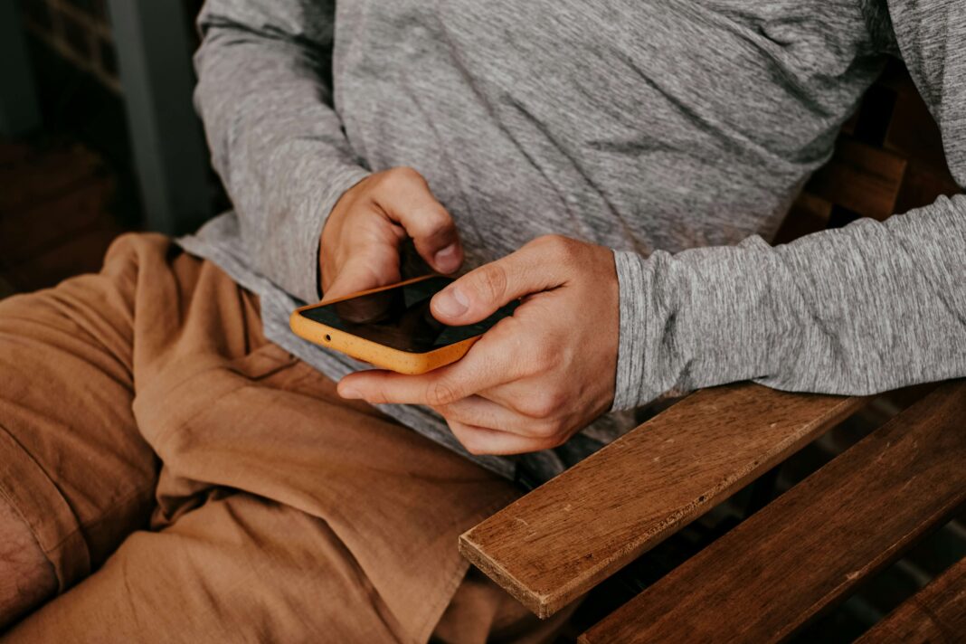 man-scrolling-on-a-phone-with-an-esim