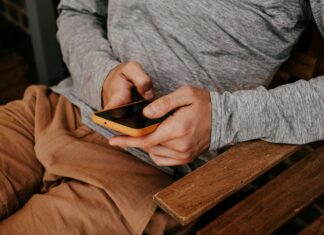 eSIM vs Physical SIM: Which Is Right For You? man-scrolling-on-a-phone-with-an-esim