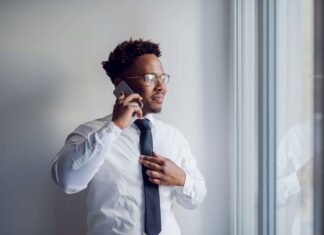 Pros And Cons Of eSIM Adoption In Enterprise man-using-an-esim-to-make-business-calls
