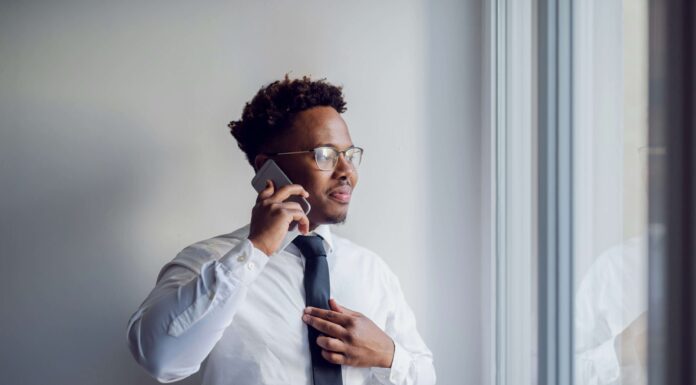 Pros And Cons Of eSIM Adoption In Enterprise man-using-an-esim-to-make-business-calls