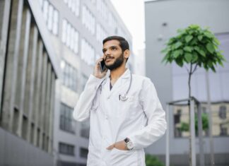 Reducing NHS Call Handling Costs with VoIP doctor-uses-voip-to-communicate-with-a-patient