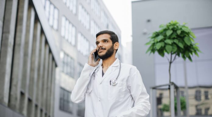 Reducing NHS Call Handling Costs with VoIP doctor-uses-voip-to-communicate-with-a-patient