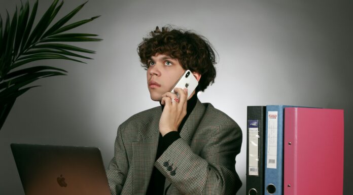 VoIP Phone Systems with 50+ Features for Small UK Businesses man-making-a-voip-phone-call