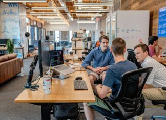 The Growing Adoption of VoIP in Emerging Markets shared-work-space-three-men-working-together