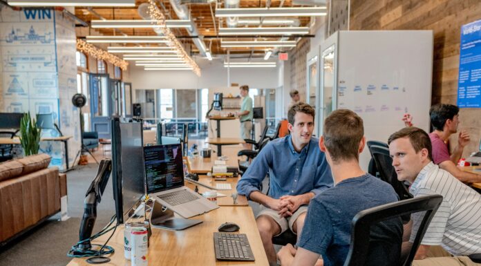 The Growing Adoption of VoIP in Emerging Markets shared-work-space-three-men-working-together