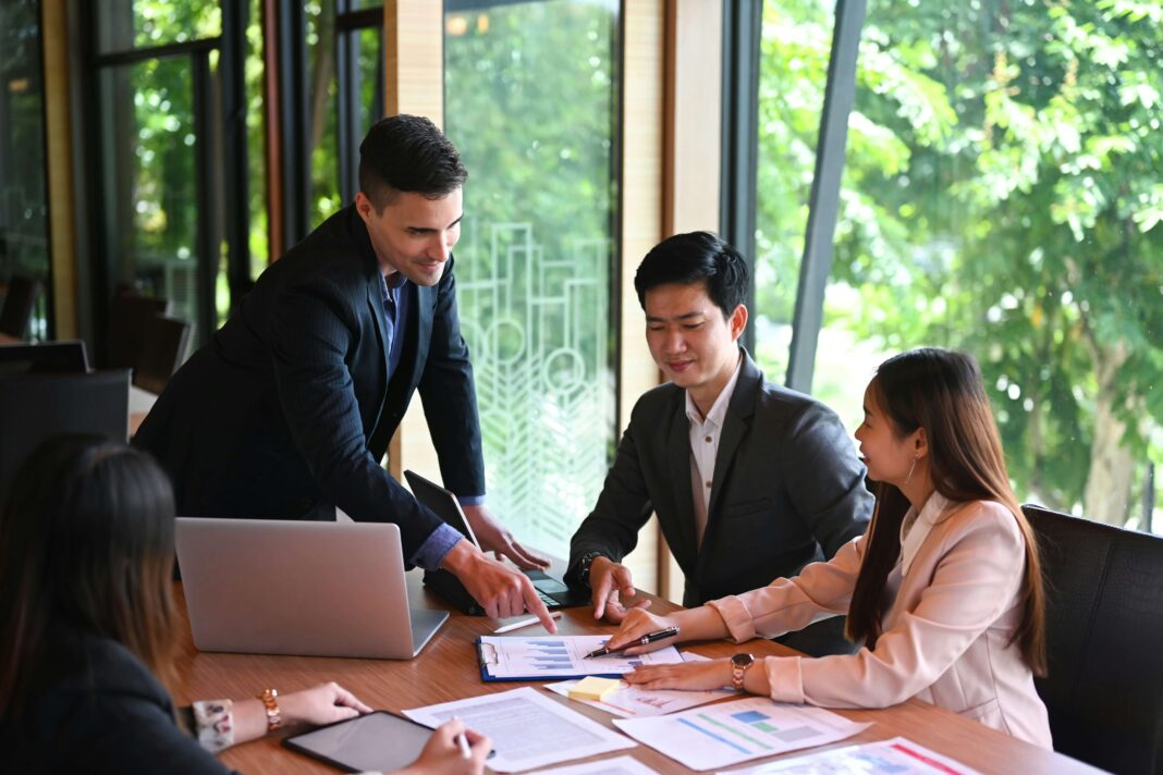 7-ways-poor-broadband-hurts-business-productivity business-meeting-in-office-with-greenery-in-window