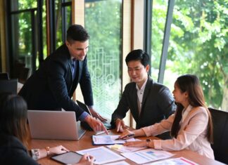 7 Ways Poor Broadband Hurts Business Productivity business-meeting-in-office-with-greenery-in-window