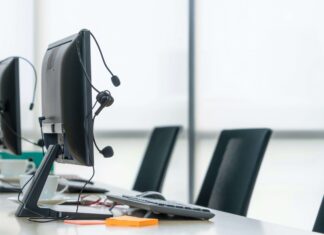 The Benefits of Using SD-WAN to Optimise VoIP Performance empty-work-desks-with-quality-headsets