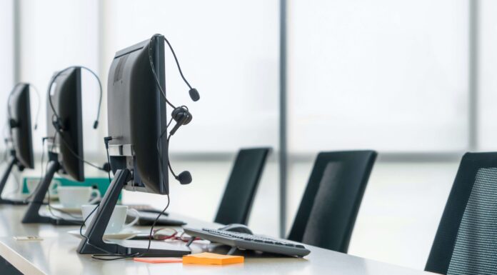 The Benefits of Using SD-WAN to Optimise VoIP Performance empty-work-desks-with-quality-headsets